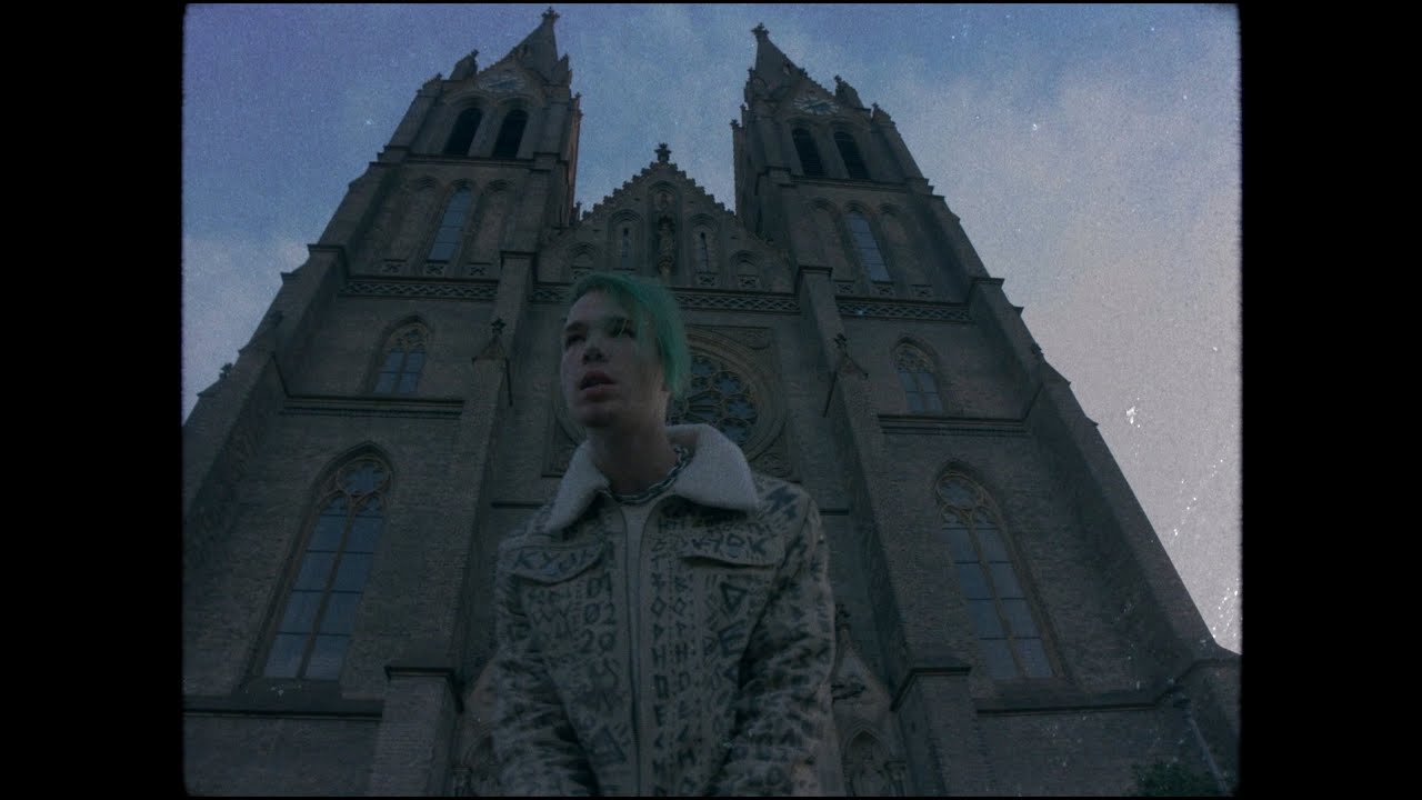 A figure in front of a gothic church in Kuok’s Airplane Mode